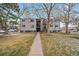 Exterior view of a two-story apartment building with landscaping and walkway at 16259 W 10Th Ave # A4, Golden, CO 80401