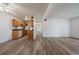 Bright living room with wood-look flooring and easy access to the updated kitchen at 16259 W 10Th Ave # A4, Golden, CO 80401