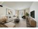 Bright living room featuring neutral tones, modern decor, and a sliding door to a balcony for natural light at 16259 W 10Th Ave # A4, Golden, CO 80401