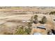 Expansive aerial view of the property featuring horses, trees, outbuildings and fenced pastures at 1991 County Road 132, Elizabeth, CO 80107