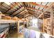 Rustic barn interior with wooden beams, stalls, and ample space for livestock or storage at 1991 County Road 132, Elizabeth, CO 80107