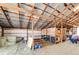 Spacious barn interior with stalls, hay storage, and metal framework at 1991 County Road 132, Elizabeth, CO 80107