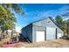 Exterior side view of barn on sunny day at 1991 County Road 132, Elizabeth, CO 80107