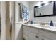 Bathroom features updated vanity, marble countertops, classic fixtures, and glass-enclosed shower at 1991 County Road 132, Elizabeth, CO 80107