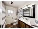 Bright bathroom with a wood vanity, modern fixtures, and stylish decorative touches at 1991 County Road 132, Elizabeth, CO 80107