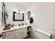 Bathroom features updated vanity, marble countertops, and classic fixtures at 1991 County Road 132, Elizabeth, CO 80107