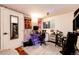 Eclectic bedroom features wood paneling and a fun workspace at 1991 County Road 132, Elizabeth, CO 80107