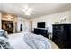 Comfortable bedroom with ceiling fan, neutral colors, and direct access to walk-in closet at 1991 County Road 132, Elizabeth, CO 80107