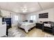 Cozy bedroom with plush bedding, neutral colors, ceiling fan, and natural light at 1991 County Road 132, Elizabeth, CO 80107