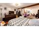 Cozy bedroom features wood-paneled walls and fun decor at 1991 County Road 132, Elizabeth, CO 80107