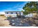 Charming single-Gathering home with a wood deck, complemented by an inviting front yard and clear blue sky at 1991 County Road 132, Elizabeth, CO 80107