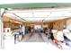 Spacious garage interior featuring built-in cabinets and lighting at 1991 County Road 132, Elizabeth, CO 80107