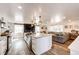 Open-concept space with a kitchen island that seamlessly connects to the living room and creates a warm, welcoming environment at 1991 County Road 132, Elizabeth, CO 80107