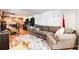 Comfortable living area with tile floors, a plush sofa, and staircase access to the upper level at 1991 County Road 132, Elizabeth, CO 80107