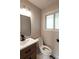 Modern bathroom features a new vanity with updated fixtures and a large mirror at 1772 Eisenhower, Louisville, CO 80027