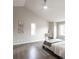 Bright bedroom featuring high vaulted ceilings, a ceiling fan, and light neutral walls at 1772 Eisenhower, Louisville, CO 80027