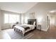 Cozy bedroom with hardwood flooring and a large window and attached seating area at 1772 Eisenhower, Louisville, CO 80027