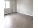 Bedroom features beautiful hardwood flooring and a large window, offering ample natural light at 1772 Eisenhower, Louisville, CO 80027