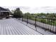 Spacious deck with black metal railing, perfect for enjoying the serene outdoor view at 1772 Eisenhower, Louisville, CO 80027