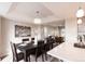 Formal dining room boasts a large table, stylish chandelier, and contemporary artwork at 1772 Eisenhower, Louisville, CO 80027
