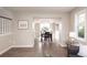 Bright dining room featuring modern light fixture, table, and hardwood flooring at 1772 Eisenhower, Louisville, CO 80027