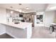 Modern kitchen features gray cabinets, stainless appliances, and a large quartz island at 1772 Eisenhower, Louisville, CO 80027