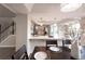 Modern kitchen with stainless steel appliances, large counter, pendant lights and bright dining area at 1772 Eisenhower, Louisville, CO 80027