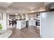 Open kitchen features gray cabinets, stainless steel appliances and a large island with seating at 1772 Eisenhower, Louisville, CO 80027