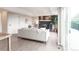 Cozy living room with fireplace and a large sliding glass door to the outside deck at 1772 Eisenhower, Louisville, CO 80027
