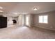 Spacious living room open to kitchen, stainless appliances, bright natural light, with door to backyard at 1772 Eisenhower, Louisville, CO 80027