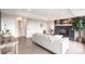 Comfortable living room with a fireplace, neutral tones, and lots of natural light at 1772 Eisenhower, Louisville, CO 80027