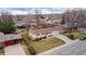 Aerial view of a single story home with a two car garage in a suburban neighborhood at 12020 W Center Ave, Lakewood, CO 80228