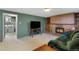 Spacious basement featuring a fireplace, entertainment area, and laundry access at 12020 W Center Ave, Lakewood, CO 80228