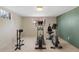 Basement exercise area equipped with various machines for a complete workout at 12020 W Center Ave, Lakewood, CO 80228