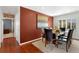 Elegant dining room features hardwood floors, modern lighting, and space for hosting at 12020 W Center Ave, Lakewood, CO 80228