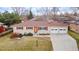 Charming single-story brick home with red shutters and a well-maintained front lawn at 12020 W Center Ave, Lakewood, CO 80228