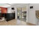 Bright kitchen with sliding glass doors leads to the backyard patio and dining area at 12020 W Center Ave, Lakewood, CO 80228