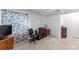 Finished basement area features an office area and adjacent storage at 5039 Fontana Ct, Denver, CO 80239