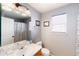 Bathroom featuring a shower/tub combo and a window at 5039 Fontana Ct, Denver, CO 80239