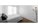 Bedroom with a bed and a lamp at 5039 Fontana Ct, Denver, CO 80239