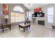 Cozy living room boasts vaulted ceilings, ample natural light, and a modern fireplace at 5039 Fontana Ct, Denver, CO 80239