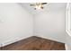This bedroom features hardwood floors, ample natural light and a ceiling fan for a comfortable and inviting space at 4062 S Atchison Way # 302, Aurora, CO 80014