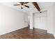 Bedroom with hardwood floors, a ceiling fan, and a spacious closet creating a welcoming and functional space at 4062 S Atchison Way # 302, Aurora, CO 80014