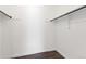 Walk-in closet offers ample storage space with hanging rods, providing practical organization solutions at 4062 S Atchison Way # 302, Aurora, CO 80014