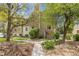 Pathway leading to a tan two-story condo building at 4062 S Atchison Way # 302, Aurora, CO 80014