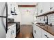 Kitchen area featuring white cabinets and stainless-steel dishwasher at 4062 S Atchison Way # 302, Aurora, CO 80014