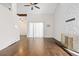Spacious living room with hardwood floors, ceiling fan, and tall ceilings at 4062 S Atchison Way # 302, Aurora, CO 80014