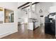Open-concept living area with modern kitchen and stone fireplace at 4062 S Atchison Way # 302, Aurora, CO 80014