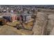 Aerial view of a home with a fenced yard surrounded by mature trees at 8493 S Newcombe Way, Littleton, CO 80127