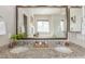 Elegant bathroom with double sinks, granite countertops, and decorative mirror at 4665 W 108Th Ct, Westminster, CO 80031